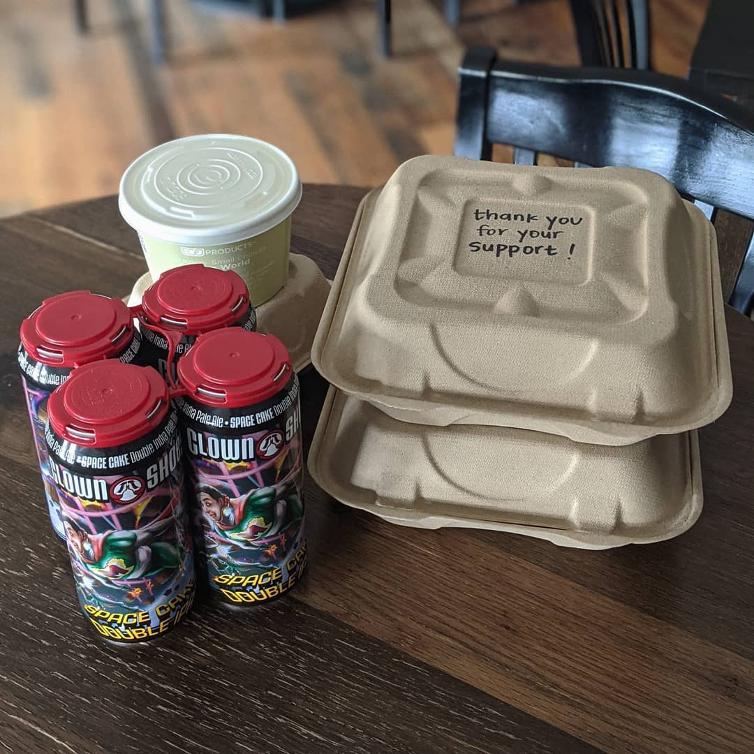 to go containers and beer on a table with the words 'thank you for your support' on top