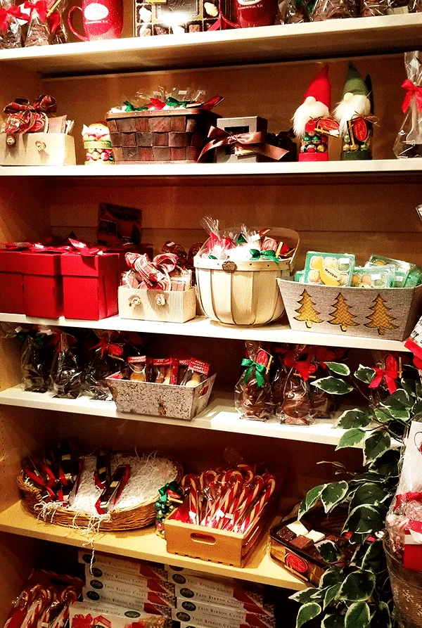 shelves filled with Christmas themed chocolates and gift boxes.
