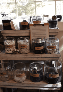Jars of rocks and bark for creating terrariums
