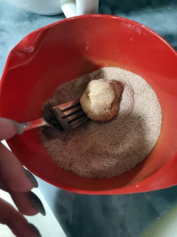 bowl of sugar for coating the cookie dough